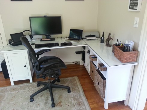 Hemnes desk minus one pedestal, plus Hemnes sofa table,  plus glass top. 